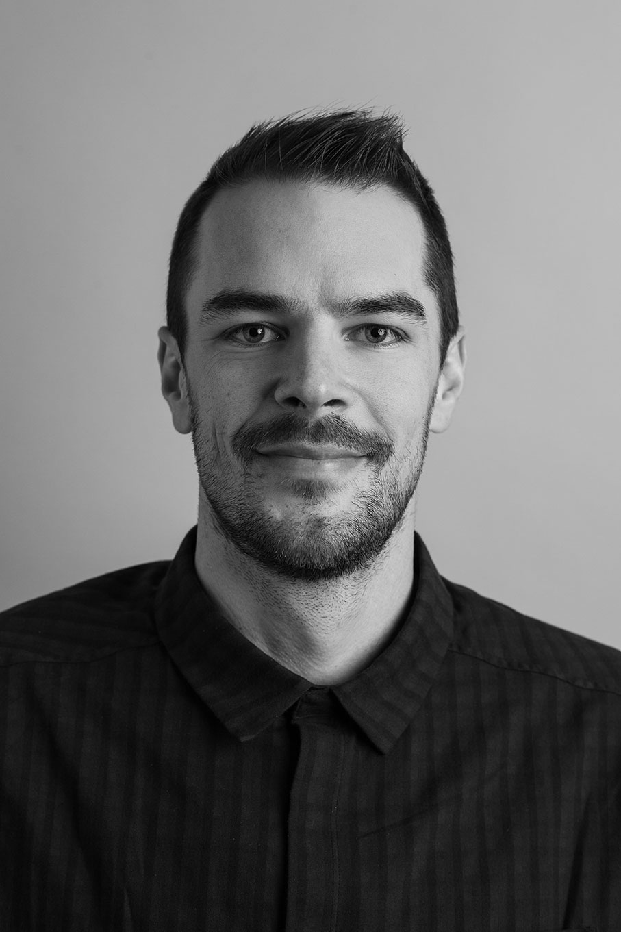 A portrait of an Olympic Industries team member, highlighting their experience in the timber industry in British Columbia, Canada. Specializing in Spruce-Pine-Fir lumber.