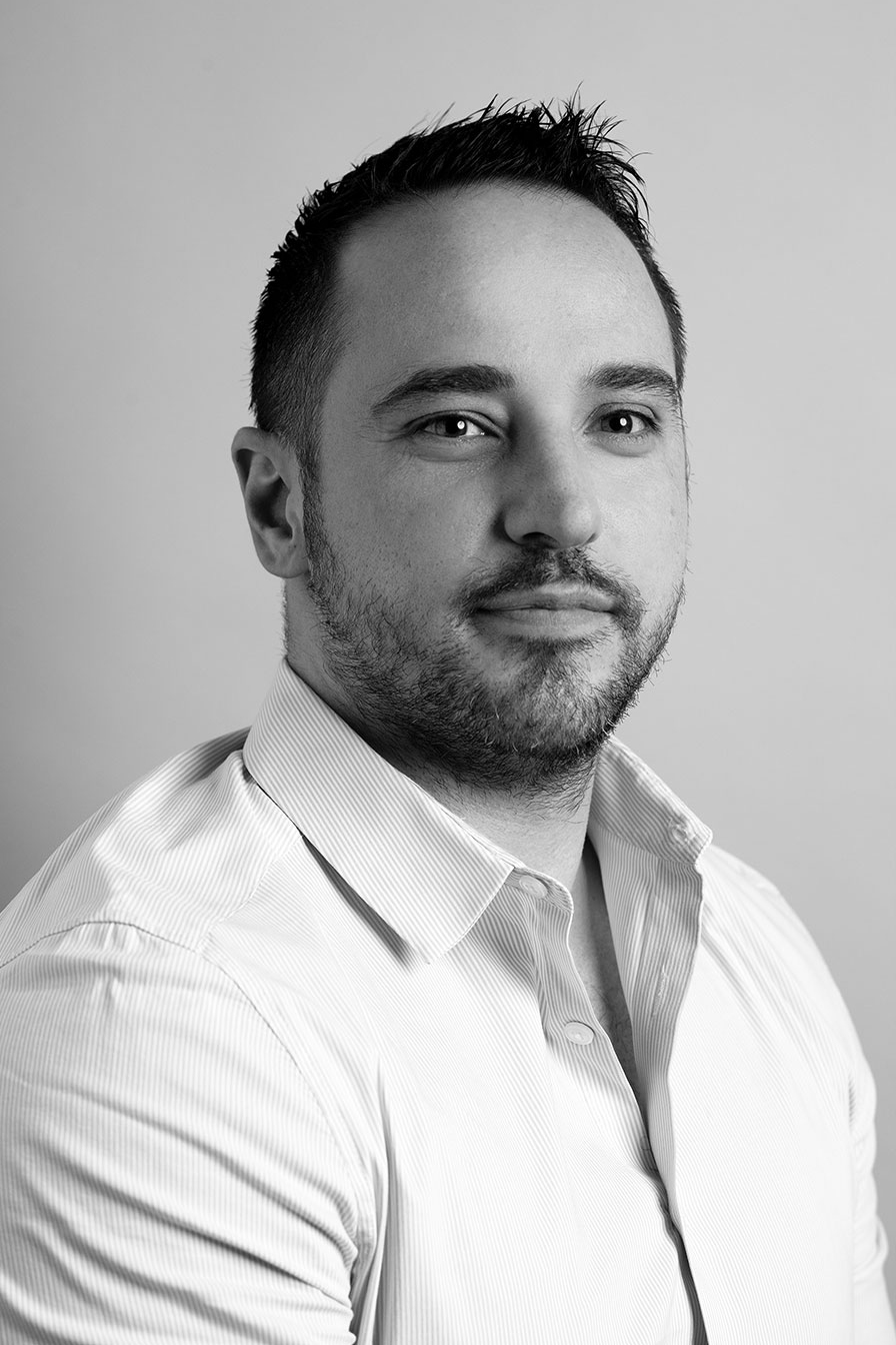 A headshot of an Olympic Industries team member, exemplifying their commitment to providing sustainable and responsibly sourced forest products in Vancouver, Canada.