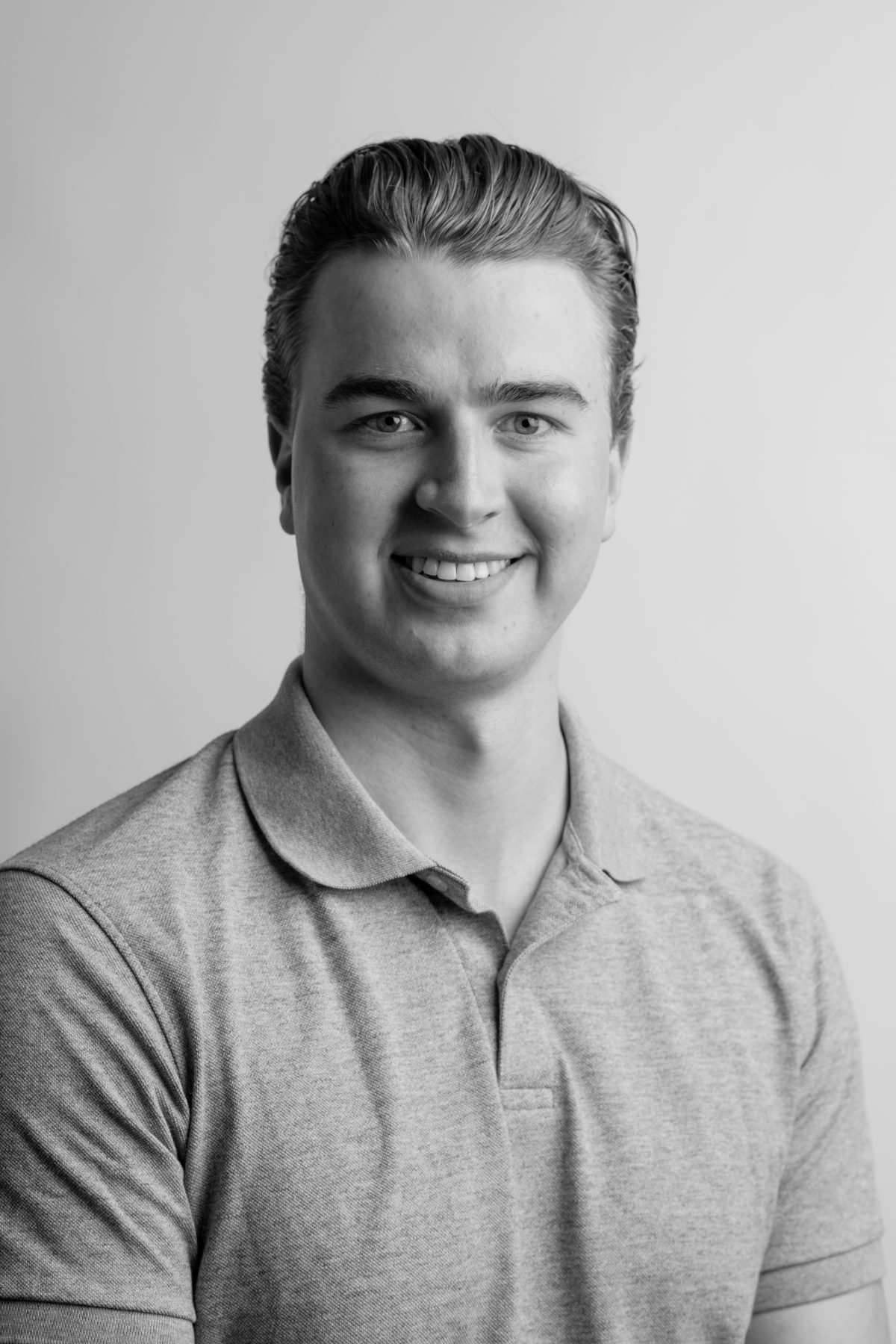 A headshot of an Olympic Industries employee, representing their experience in the wood wholesale market in Vancouver, Canada. Specializing in SYP lumber.