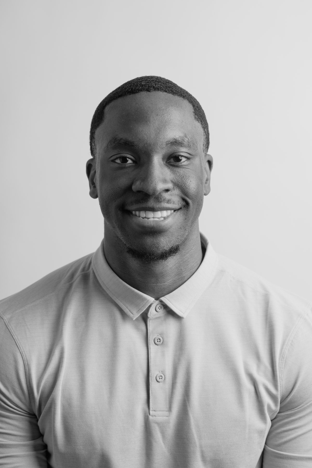 A headshot of an Olympic Industries employee, highlighting their expertise in providing high-quality lumber and building materials in Vancouver, Canada. Specializing in Cedar decking.