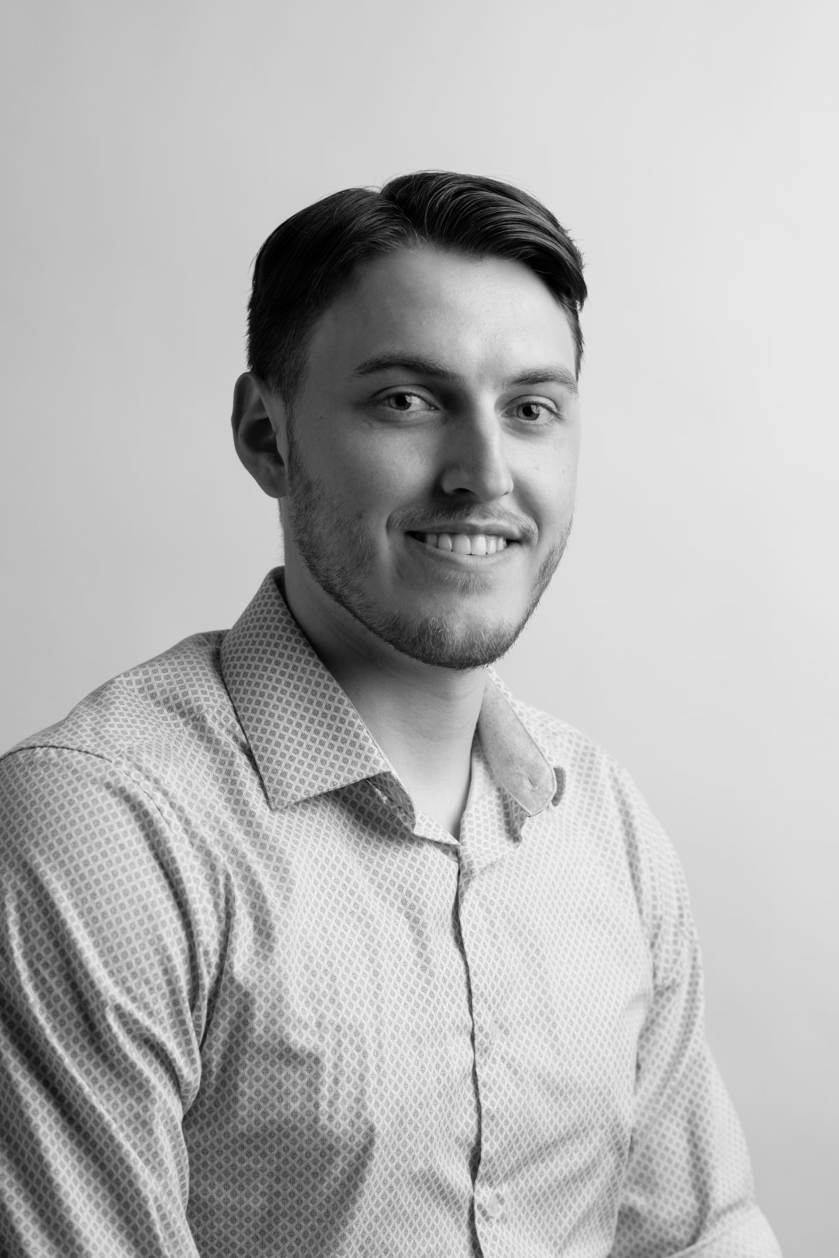 A professional photo of an Olympic Industries representative, representing their role as a leading building material supplier in Vancouver, Canada. Specializing in Composite decking.