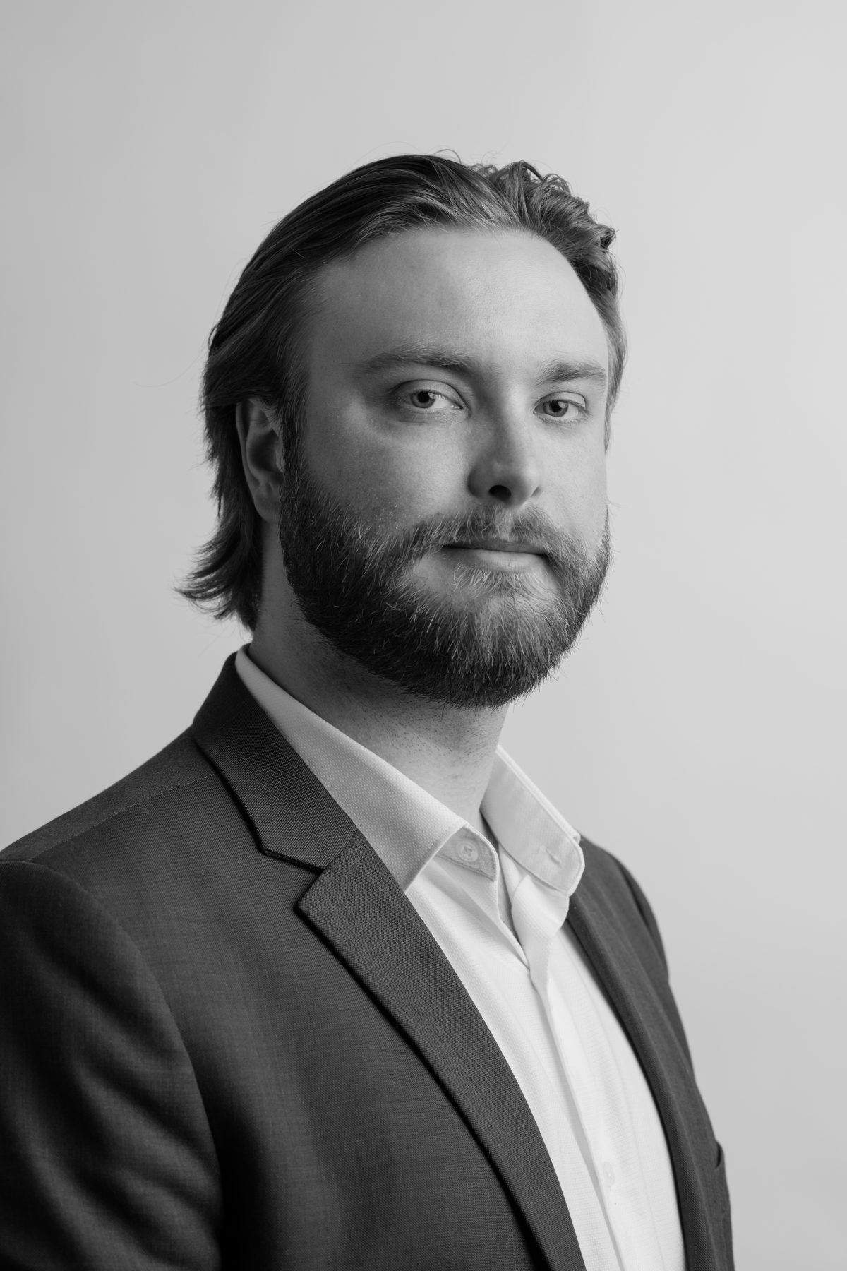 A headshot of an Olympic Industries staff member, emphasizing their expertise in the flooring industry in Vancouver, Canada. Specializing in Hardwood flooring.