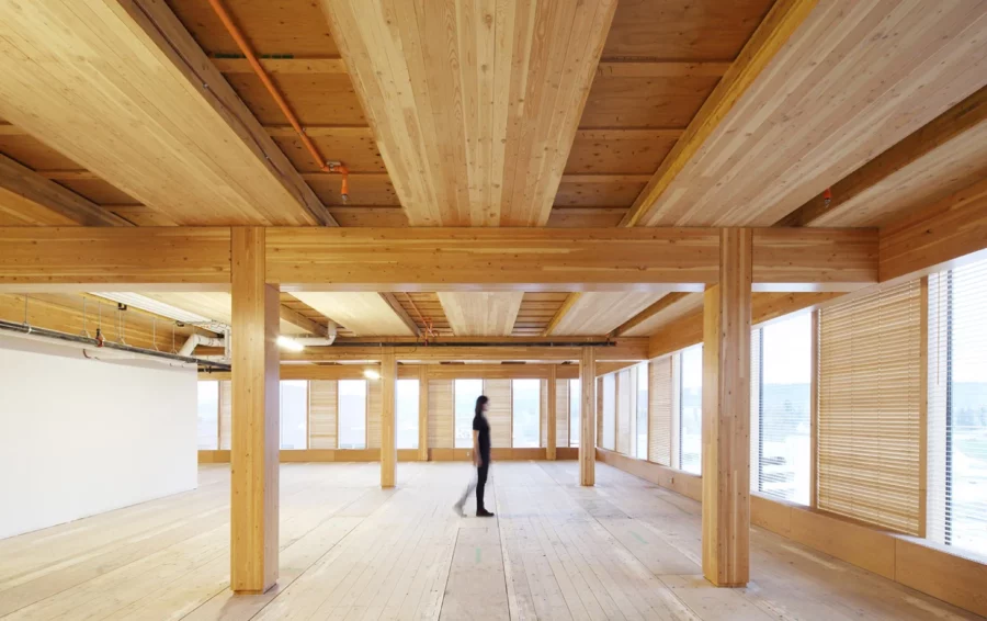 Women walking in the middle of a CLT Mass Timber Construction Project