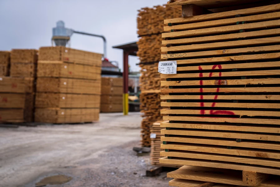 Lumber yard holding pallets of pressure treated wood