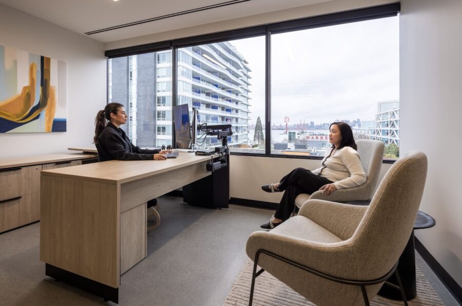 Employees conversing in an office